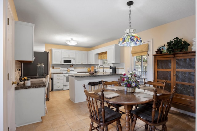 dining area with light tile patterned flooring