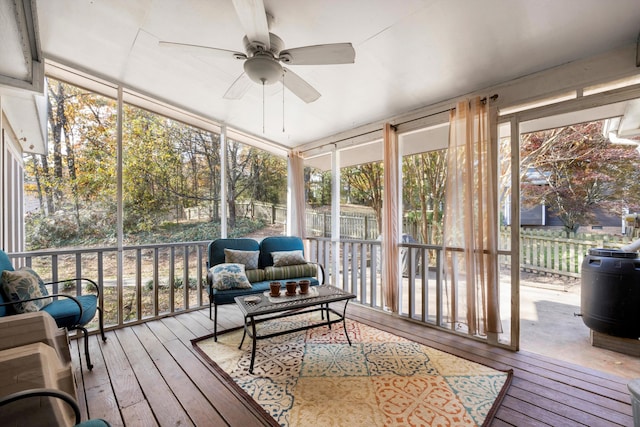 sunroom with a ceiling fan