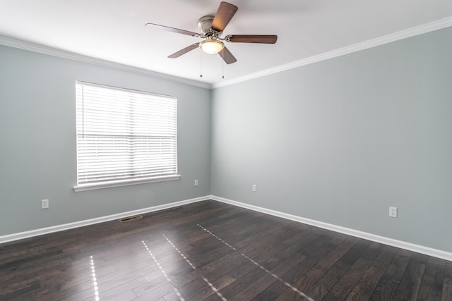 spare room featuring ceiling fan, ornamental molding, and dark wood-type flooring