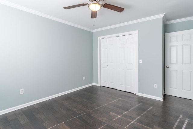 unfurnished bedroom featuring ceiling fan, a closet, dark wood-type flooring, and ornamental molding