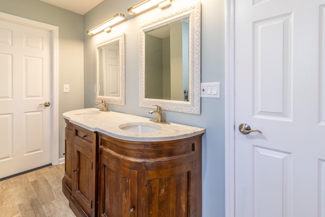 bathroom featuring hardwood / wood-style floors and vanity