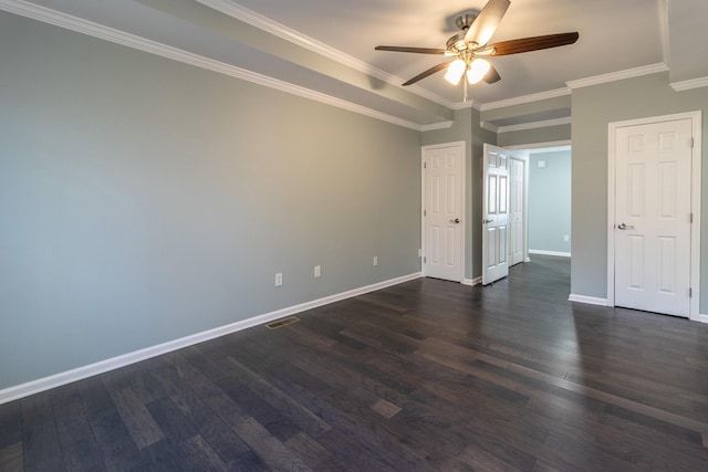 empty room with ceiling fan, dark hardwood / wood-style floors, and ornamental molding