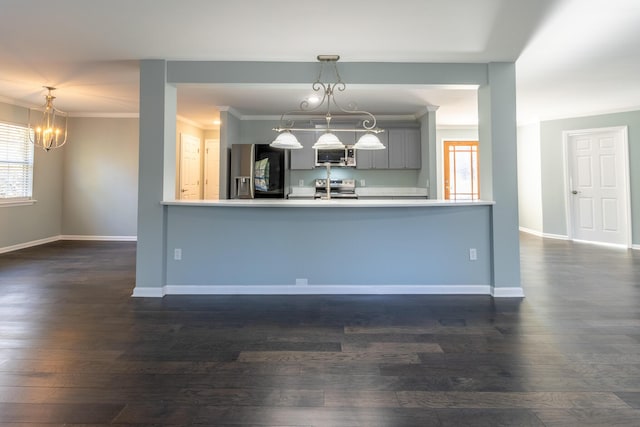 kitchen with gray cabinets, pendant lighting, dark hardwood / wood-style floors, and appliances with stainless steel finishes