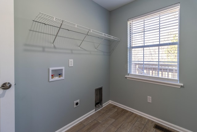 laundry area featuring electric dryer hookup, wood-type flooring, and hookup for a washing machine