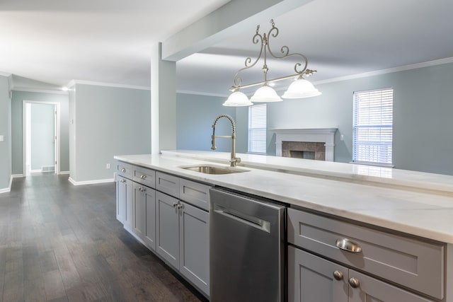 kitchen featuring dishwasher, sink, light stone counters, pendant lighting, and gray cabinets