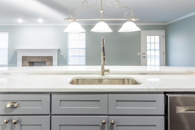 kitchen featuring gray cabinets, light stone countertops, and sink