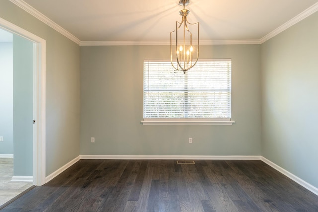 spare room featuring a notable chandelier, dark hardwood / wood-style flooring, and crown molding