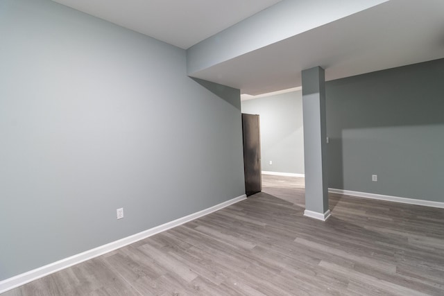 spare room with light hardwood / wood-style flooring