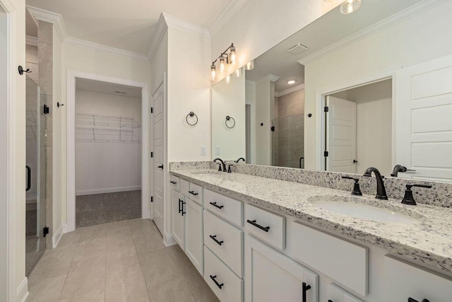 1699 Whisper Winds Ln Unit 34, Ooltewah, TN 37363 - bathroom featuring a stall shower, a spacious closet, double vanity, crown molding, and tile patterned flooring