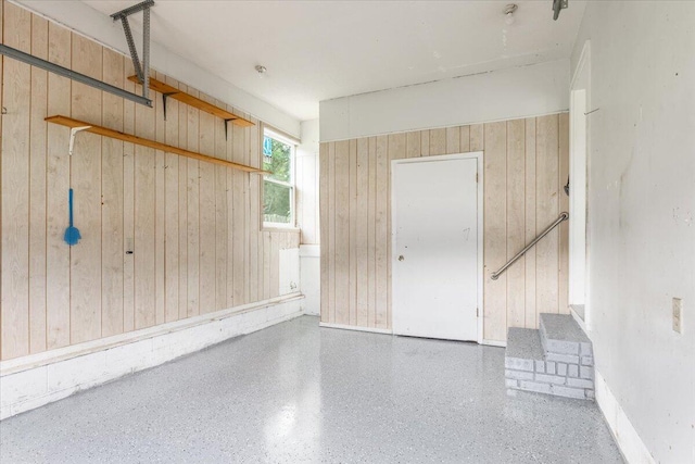 garage with wood walls