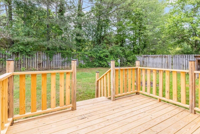 wooden terrace featuring view of scattered trees
