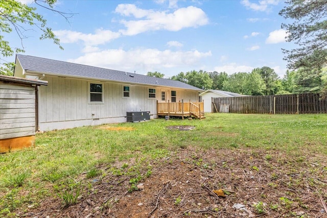 rear view of property featuring a deck, central AC, and crawl space