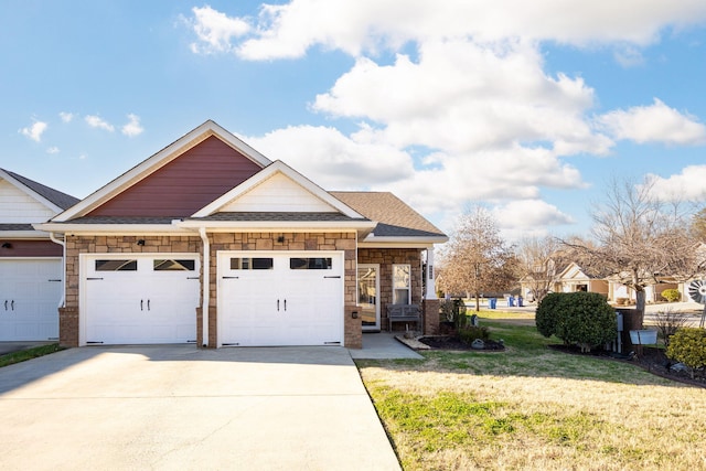 view of front of home with a garage and a front lawn