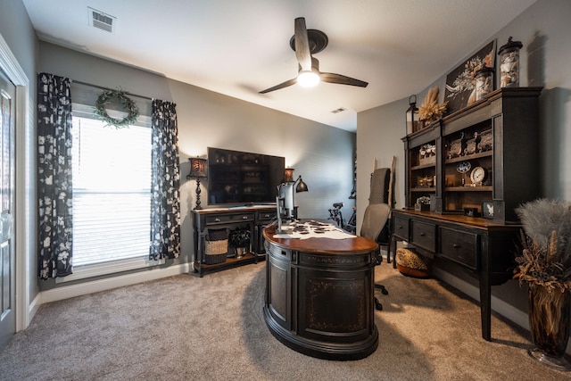 home office with ceiling fan and light colored carpet