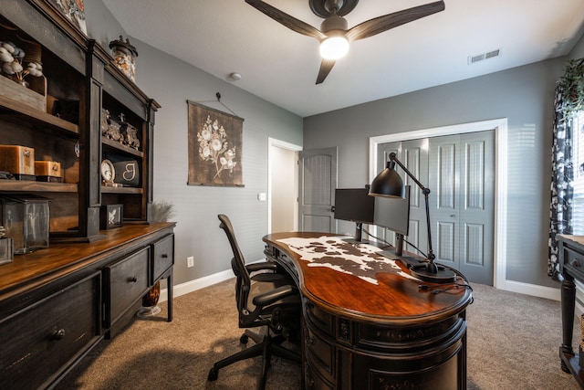 office area with carpet floors and ceiling fan