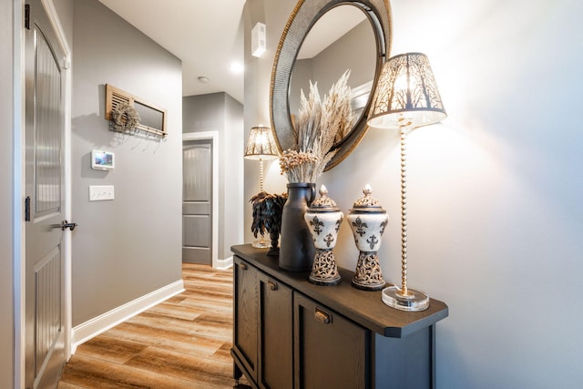 hall with light hardwood / wood-style floors