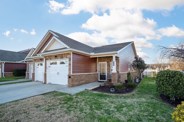 view of front of property featuring a garage and a front lawn