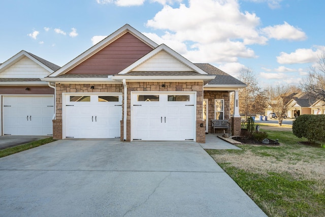 view of front facade with a front yard and a garage