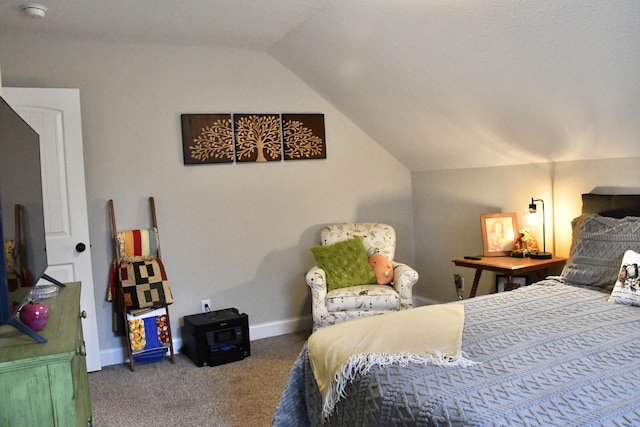 carpeted bedroom with lofted ceiling