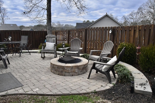 view of patio / terrace featuring a fire pit