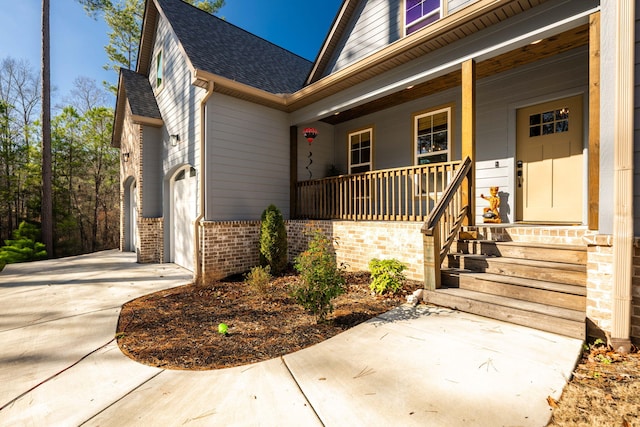 entrance to property featuring a porch