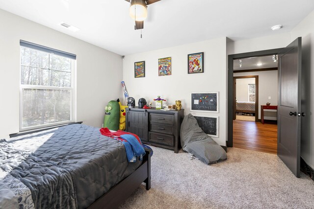 carpeted bedroom with ceiling fan