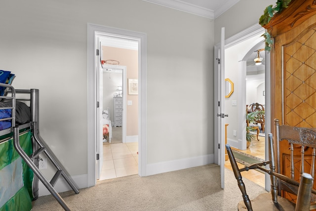 bedroom featuring light colored carpet and ornamental molding