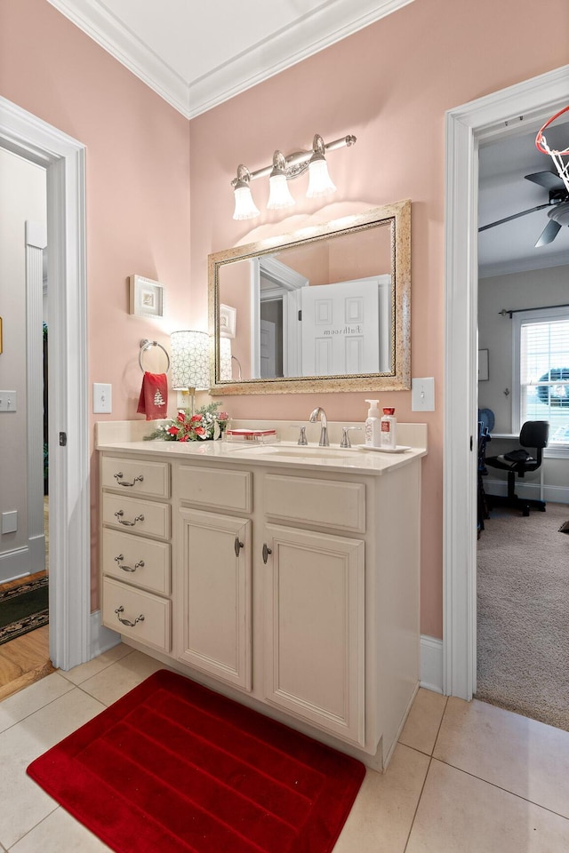 bathroom featuring tile patterned flooring, vanity, ceiling fan, and crown molding