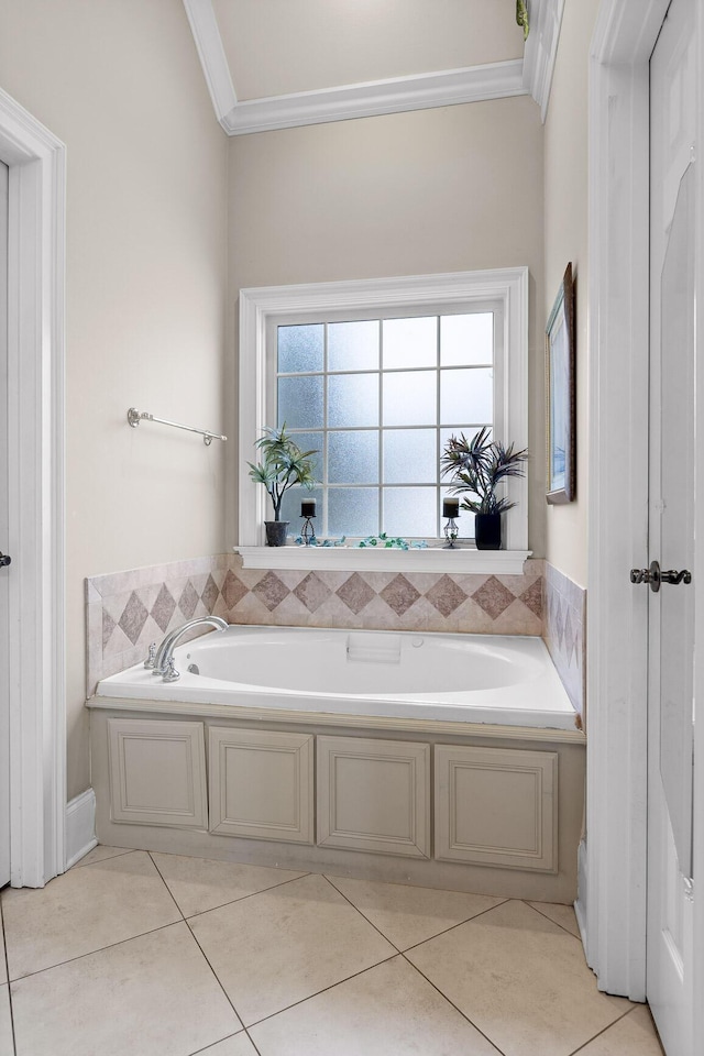 bathroom featuring a tub, tile patterned flooring, and ornamental molding