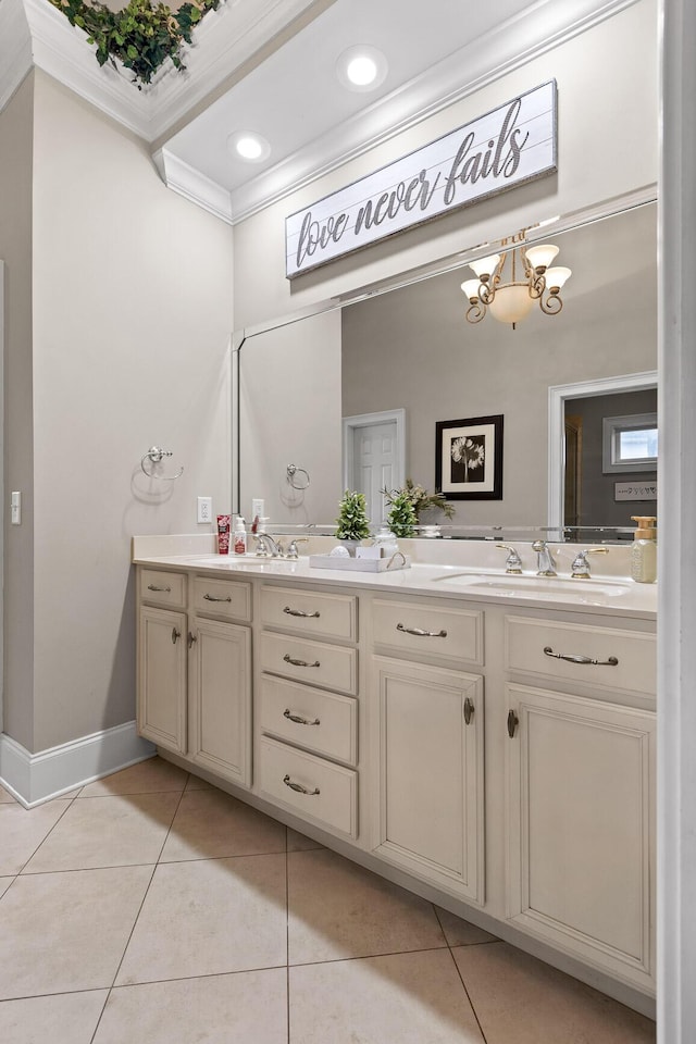 bathroom featuring crown molding, tile patterned flooring, vanity, and a notable chandelier