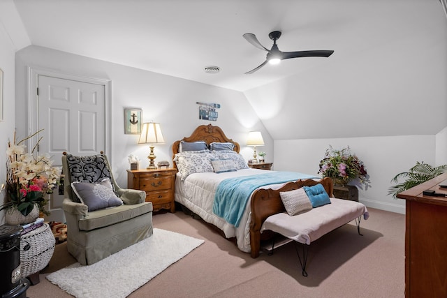 carpeted bedroom featuring ceiling fan and vaulted ceiling