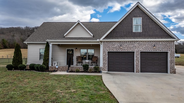 view of front of house featuring a front yard and covered porch