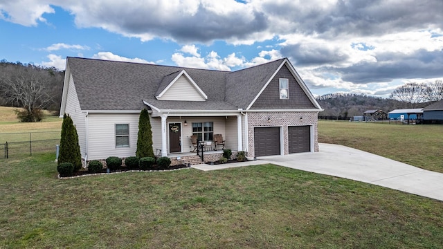 craftsman inspired home featuring a front lawn, a porch, and a garage