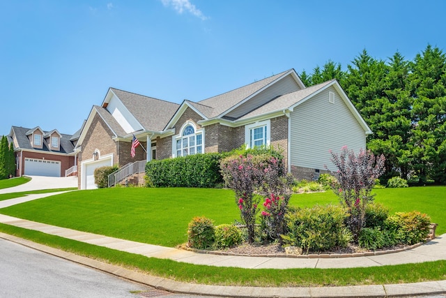 view of front of house featuring a front lawn and a garage