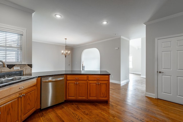 kitchen featuring kitchen peninsula, a chandelier, stainless steel dishwasher, and sink