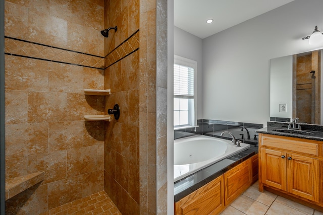 bathroom featuring tile patterned flooring, vanity, and separate shower and tub