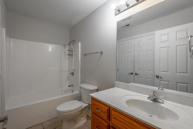 full bathroom with vanity, a textured ceiling, shower / bathing tub combination, tile patterned flooring, and toilet