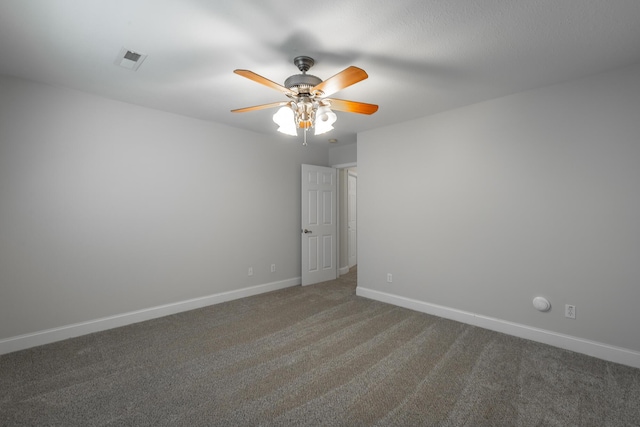 carpeted empty room featuring ceiling fan