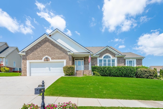 view of front of house with a front yard and a garage