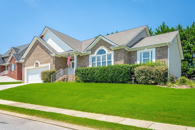 view of front facade with a front yard and a garage