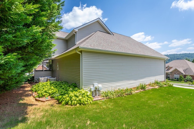 view of property exterior with a lawn