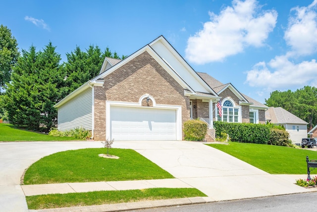 view of front of home with a garage and a front yard