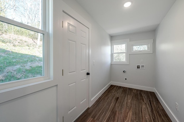 clothes washing area featuring washer hookup, dark hardwood / wood-style flooring, and electric dryer hookup