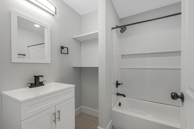 bathroom featuring tile patterned floors, vanity, and bathtub / shower combination