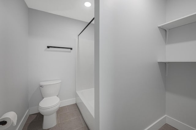 bathroom featuring tile patterned floors and toilet