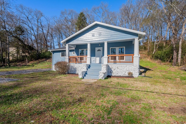 view of front of house with a front lawn and covered porch