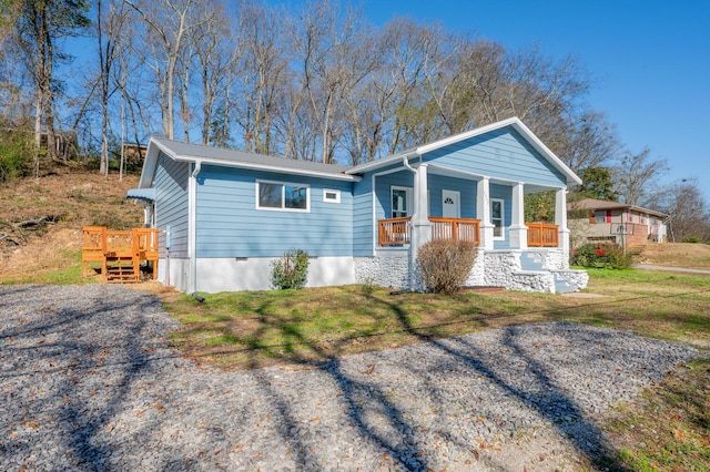 view of front of home featuring a front yard and a porch