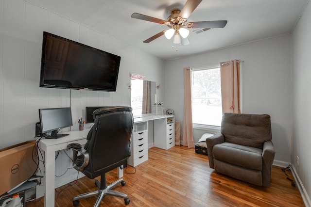 office with ceiling fan and light hardwood / wood-style flooring