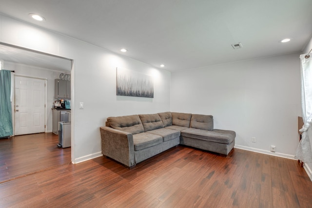 living room with dark hardwood / wood-style flooring