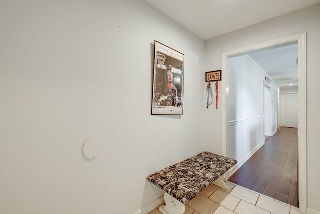 hallway featuring light tile patterned floors